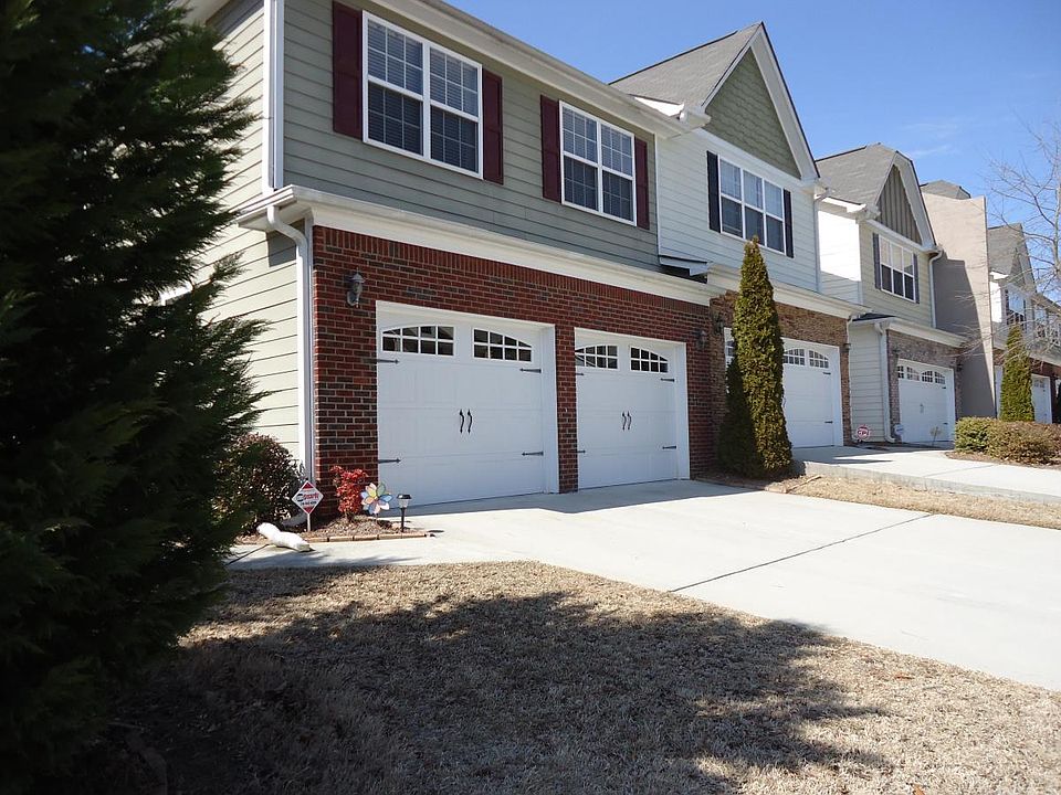 front of the house - windows on all 3 sides of the house. 2 car garage-2 separate doors, with and extended driveway