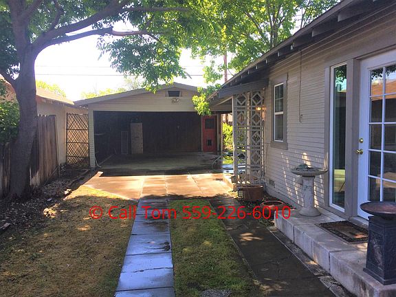 Driveway with double carport in back
