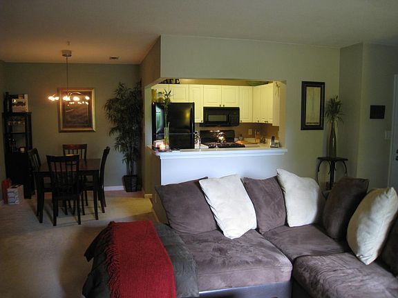 View of living room, dining room, and kitchen from the balco