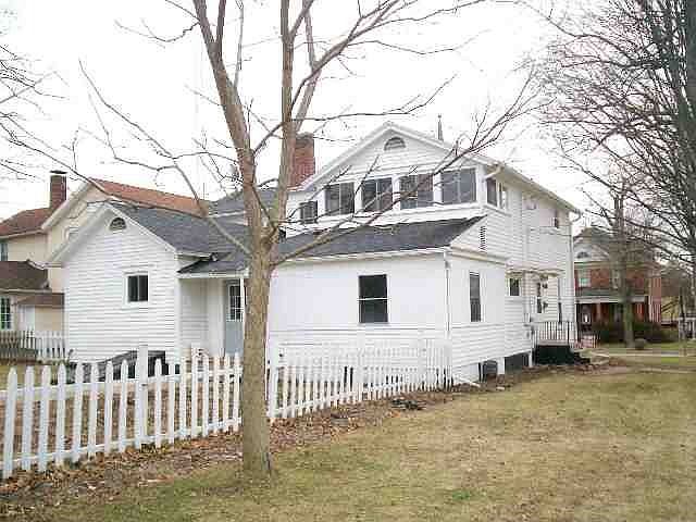 Back side view 2/2 car garages are to left out of photo with new doors 4-06