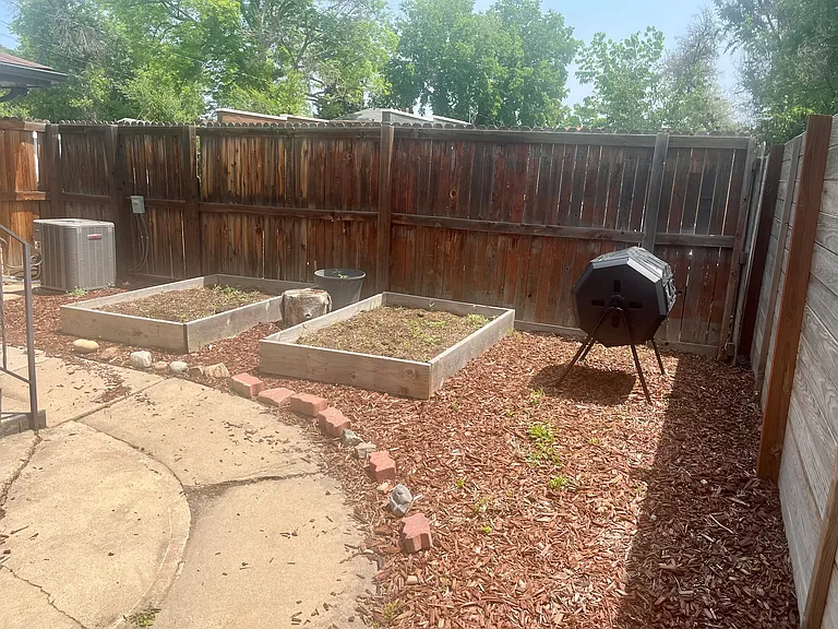 shared backyard space for gardening, grilling