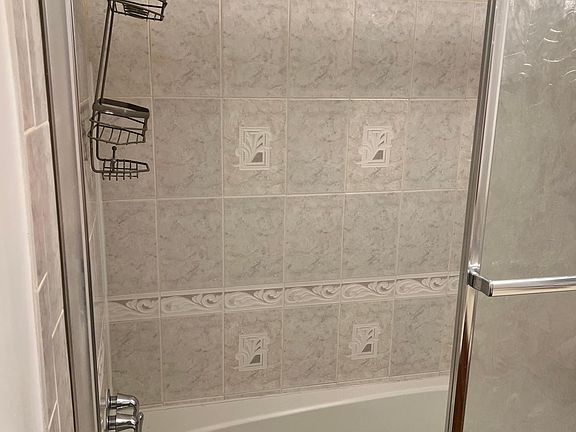 Jetted tub with shower