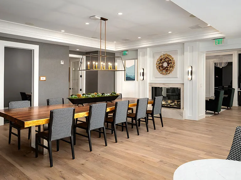 Warm Meeting Space with Fireplace and Long Communal Table