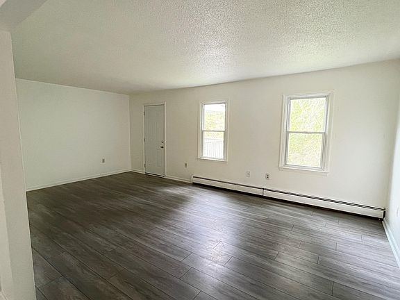 Living room opens to outdoor deck area.