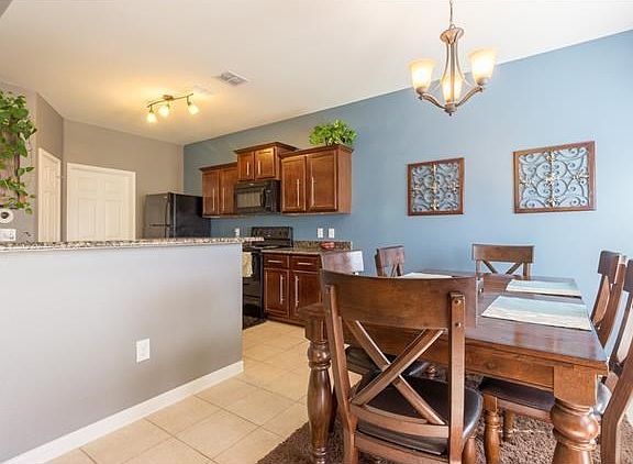 Kitchen has beautiful granite counters, upgraded lighting in kitchen and dining room. New hardware o
