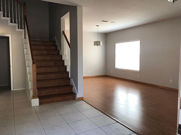 Formal living and dinning areas taken from main entrance. Half rest room on the left next to stairway.