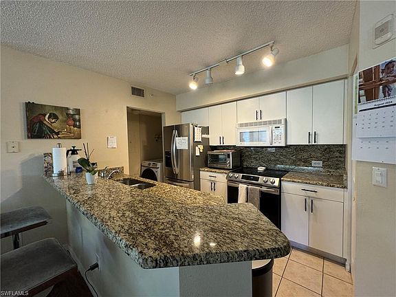 2nd image of 8950 Colonnades Ct E APT 821