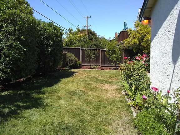 Plenty of backyard lawn for games and relaxation