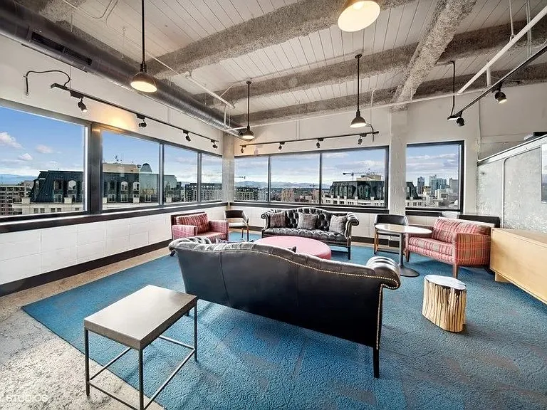 Penthouse entertainment lounge with comfortable seating at Archer Tower in Denver, CO