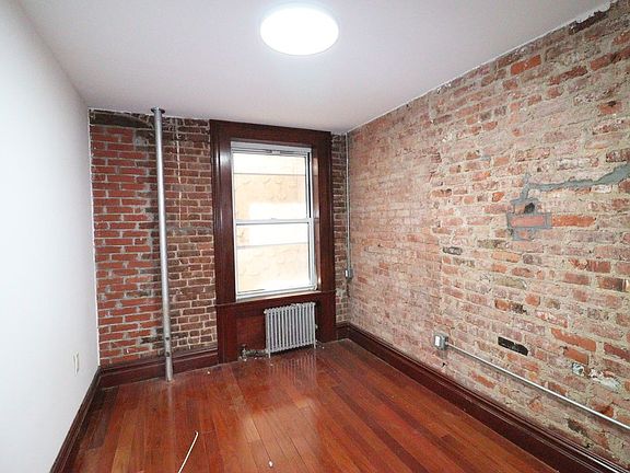 3rd image of 150 E 3rd St APT 3E