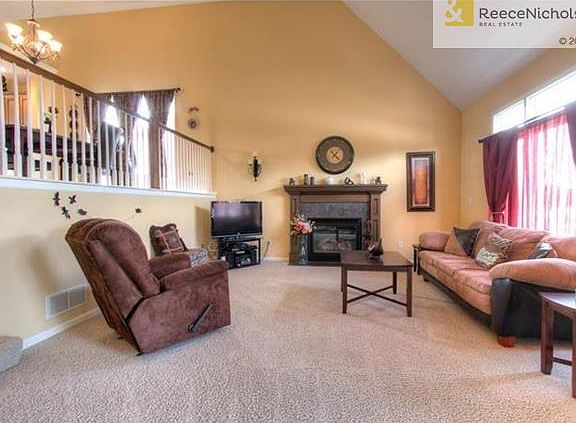 Great room features vaulted ceiling and fireplace