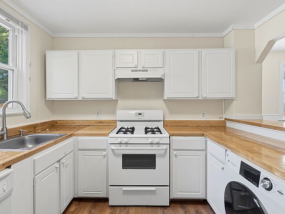 Kitchen angle 3 with in unit laundry. All the appliances as well.