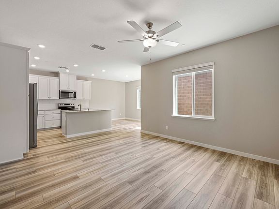 The Willow has an open layout with the kitchen being open to the dining room and family room.