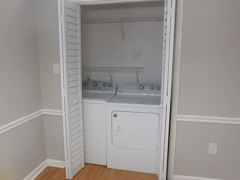 laundry closet with washer/dryer included