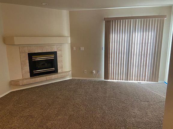 Gas fireplace in first floor living room. Sliding door to small rear patio.