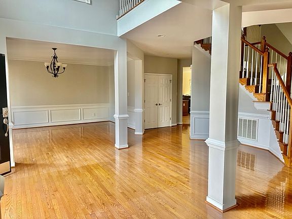 Beautiful entry with access to sitting room and dining room as well as curved staircase