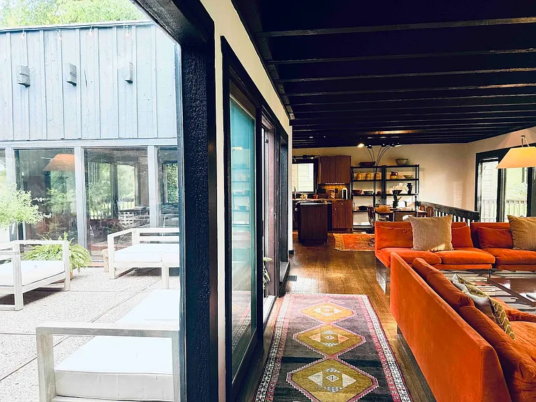 Living room with atrium in center of home