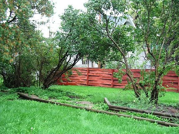 The lower level unit walks out to the backyard.