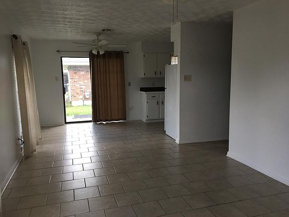 Living room/Dining room with Sliding Glass Door to Outside
