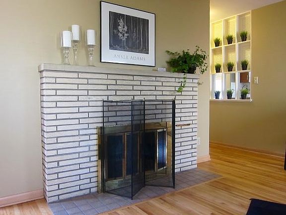 Wood burning fireplace adds great ambience and focal point in living room!