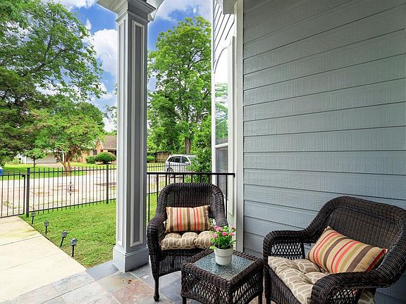 Enjoy a cup of coffee or a cocktail on this relaxing front porch