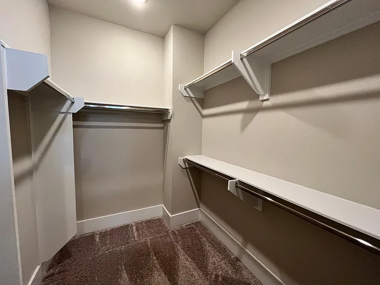 Spacious primary closet.