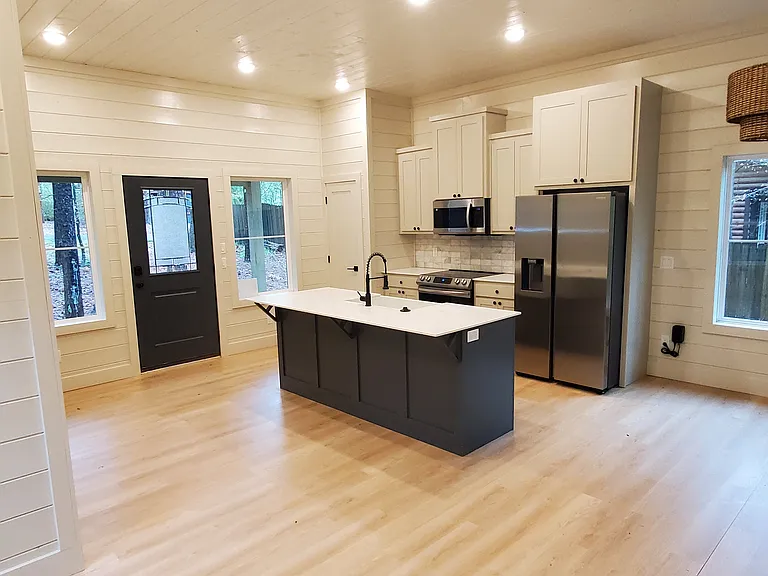 Full kitchen with all appliances - fridge/freezer, stove/oven, microwave, dishwasher.