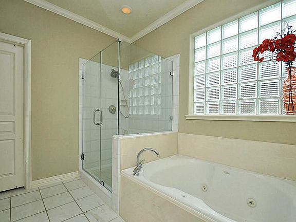 Master Bath with double sinks, separate shower & bathtub.