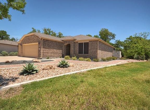 Adjacent to a greenbelt and also snuggling Cowan Creek, there is plenty of privacy at this special Sun City Texas Copper Ridge with a Three-Car Garage.