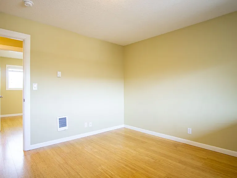 Get 1 Month FREE! Top-Floor 2-Bedroom with Bamboo Flooring + Off-Street Parking! — Photo 12