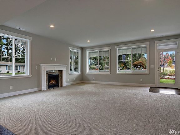 Family Room with cozy gas fireplace.  Photo not of actual home and may include options.