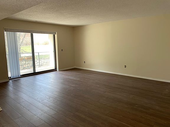 living room with west-facing balcony