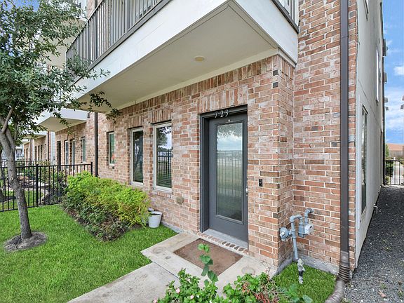 Entry of the house with small green space.