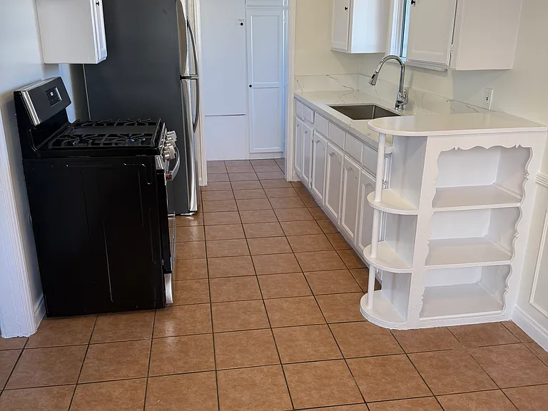 South view of the kitchen with service porch in background.