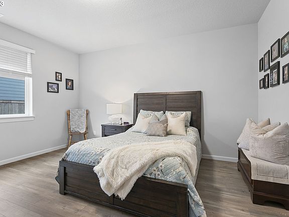 Master Bedroom with Walkin Closet and attached Bathroom with 2 sinks.