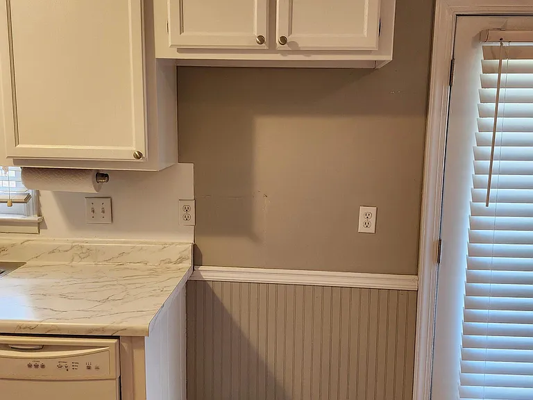 Kitchen: Closeup view showing dishwasher & new countertops, sink & faucet; must furnish own refrigerator!