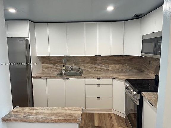 2nd image of 1475 NE 125th Ter APT 614K