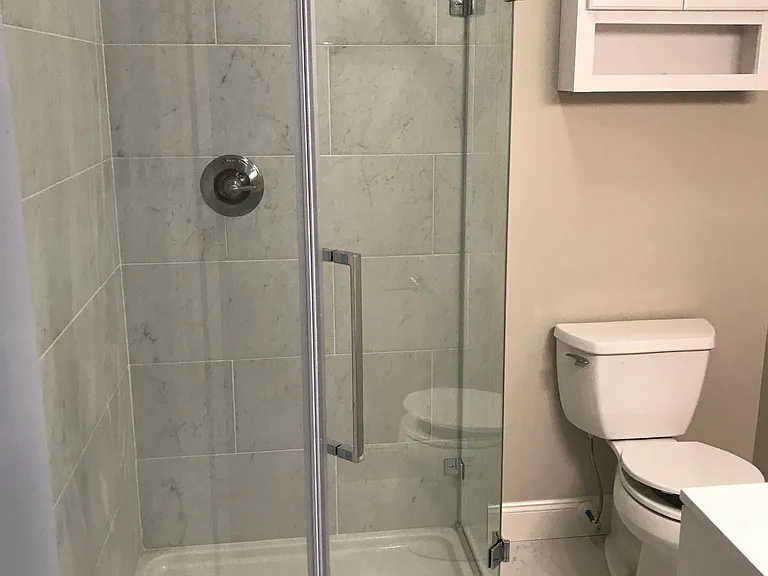Brand new bathroom with walk in shower in master bedroom off family room