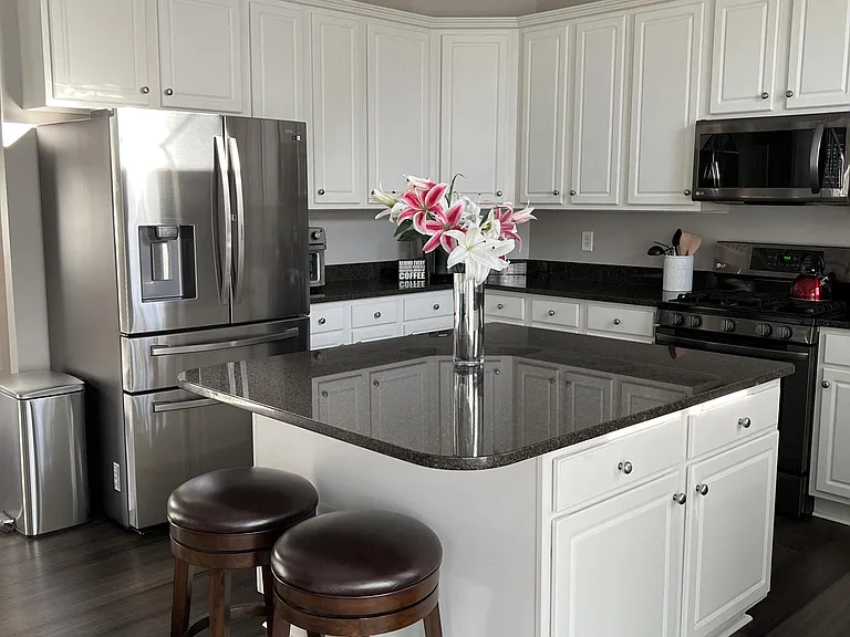 Full island with storage in the open, 2 story kitchen