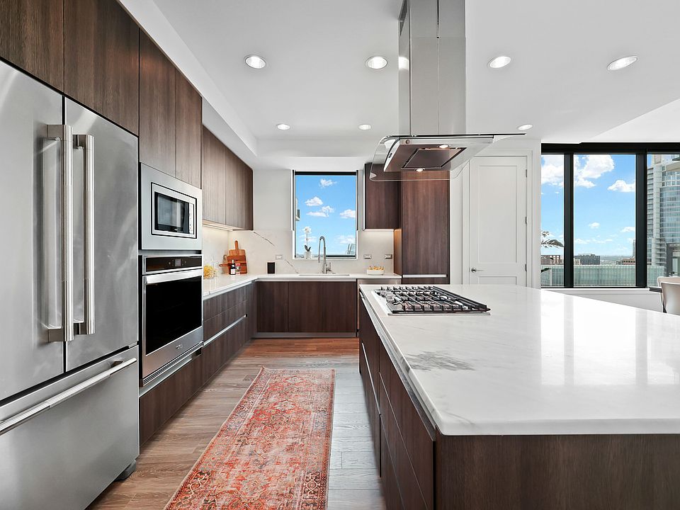 Open Concept Kitchen & Living with built-in desk and island