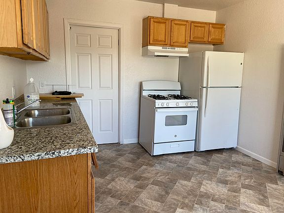 Kitchen has new floor and counter top, fresh paint