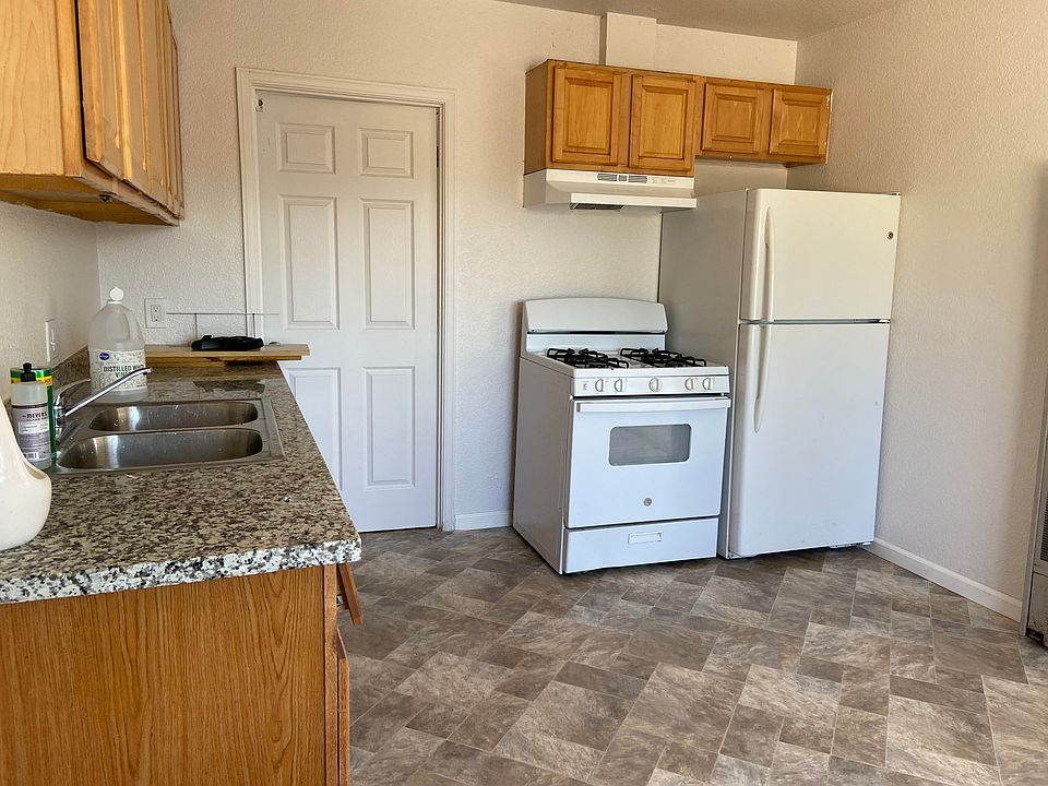 Kitchen has new floor and counter top, fresh paint