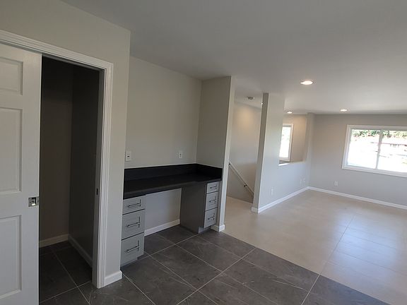 Kitchen pantry on right, has built-in desk, file size drawers on each side or set-up your own private bar collection.