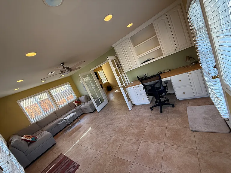 Sunroom with office desk setup