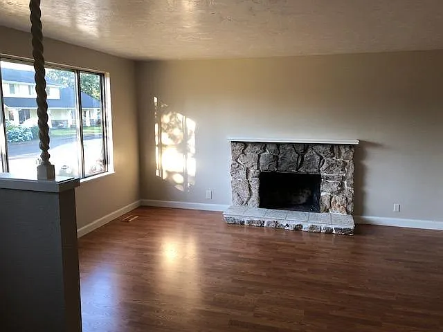 This is the formal living room just to the left as you come in the front door. There will be a faux fire set up inside of the fire place that will be remote operated.