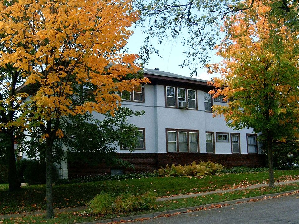 Full Wall of windows overlooks neighborhood park