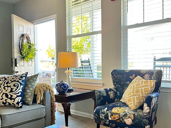 Cozy living room with couch and two chairs, 50" TV, cable and internet included