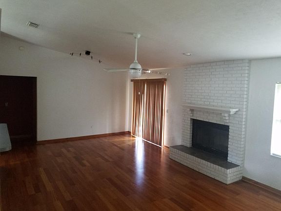 Living/family room, fire place and sliding doors to back yard.