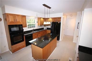 Kitchen with BRAND NEW granite and wall convection oven/microwave