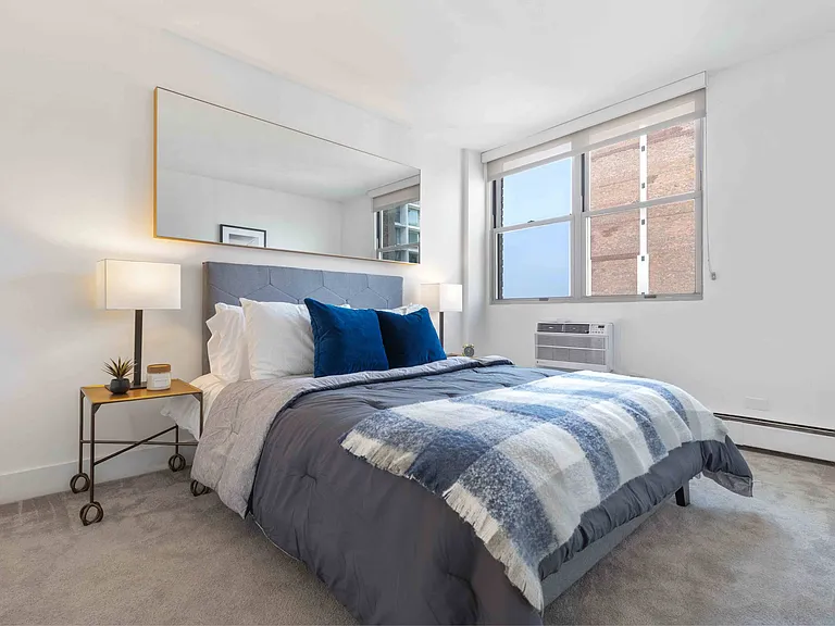 Bright bedroom with plush carpeting